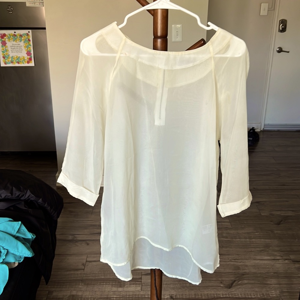 Cream blouse with golden undertones